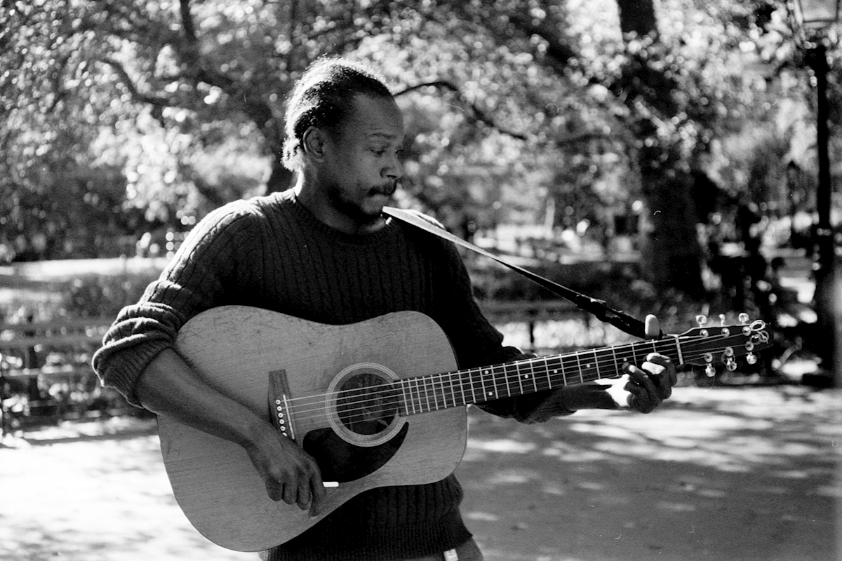 person playing guitar outside